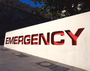 Large outdoor sign that says: EMERGENCY