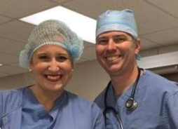Picture of a female and male Anesthetist, smiling.
