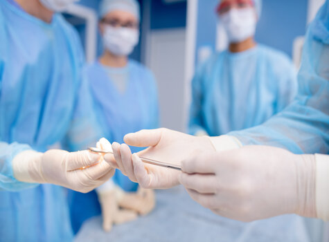 doctors in surgical gear and gloves